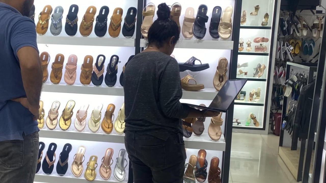 Woman's Shoe Shopping During Meeting Sparks Work-Life Balance Debate