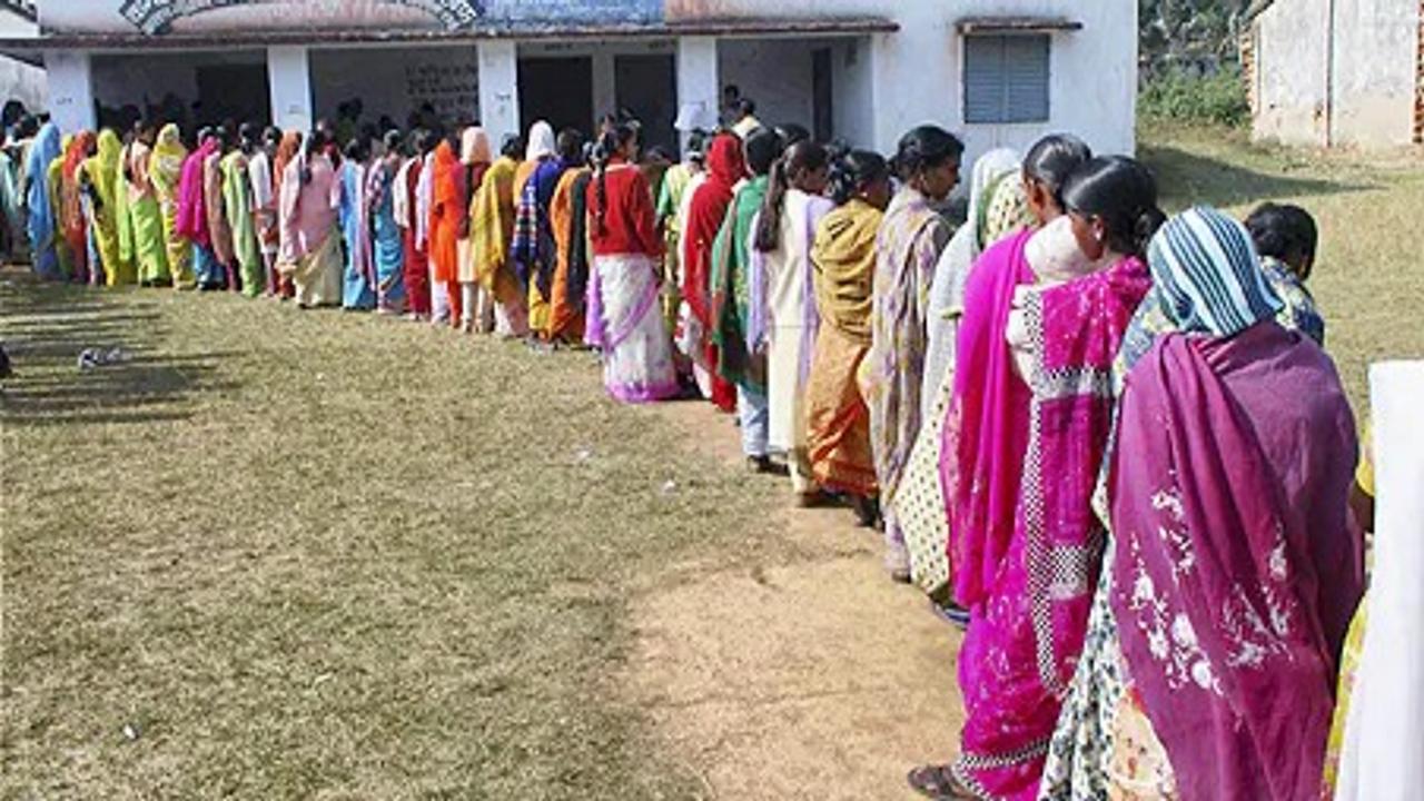 Son carries mother to Polling Booth in Jharkhand