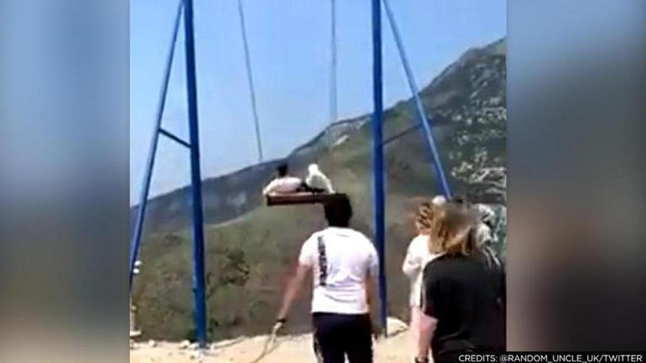 Women fall off swing