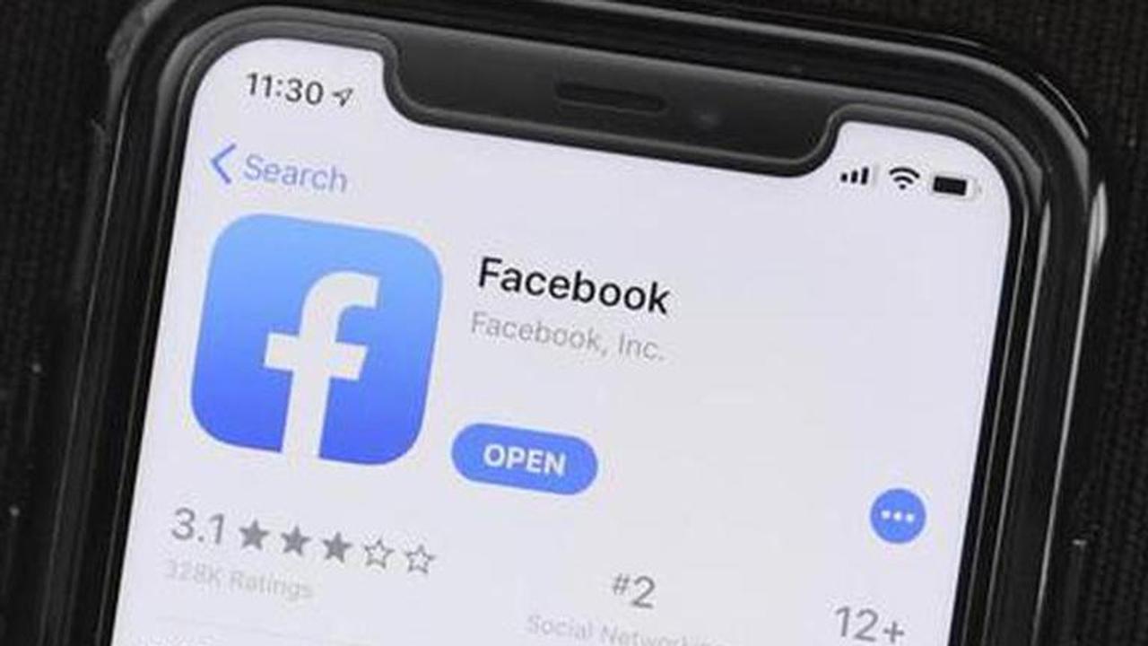 Facebook bans some, but not all, QAnon groups, accounts