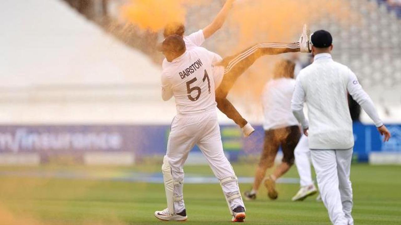 Jonny Bairstow carries pitch invader off the field as climate activists halt Ashes Test at Lord's