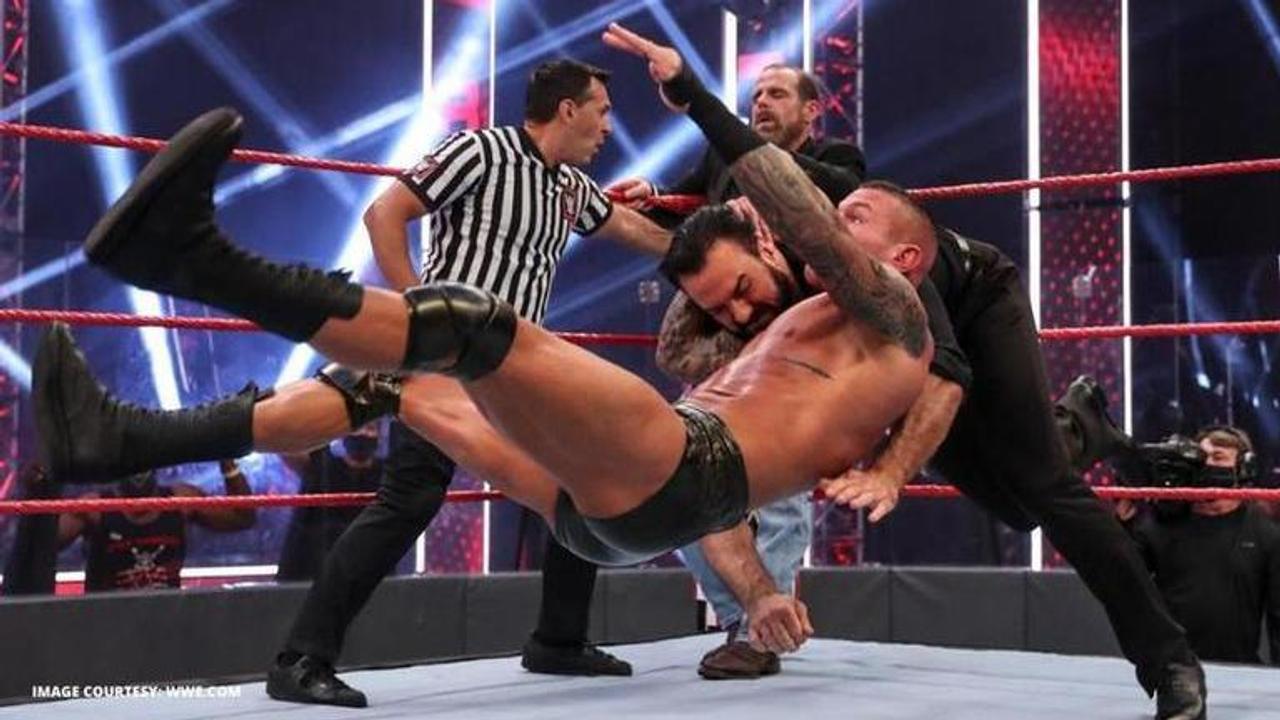 Randy Orton attacks Shawn Michaels before hitting Drew McIntyre with an RKO