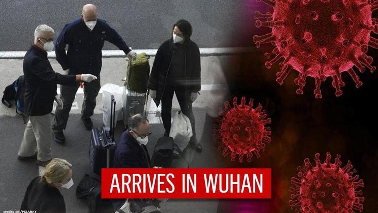 WHO team arrives in Wuhan to probe into COVID-19 origins as virus kills 1.9 million