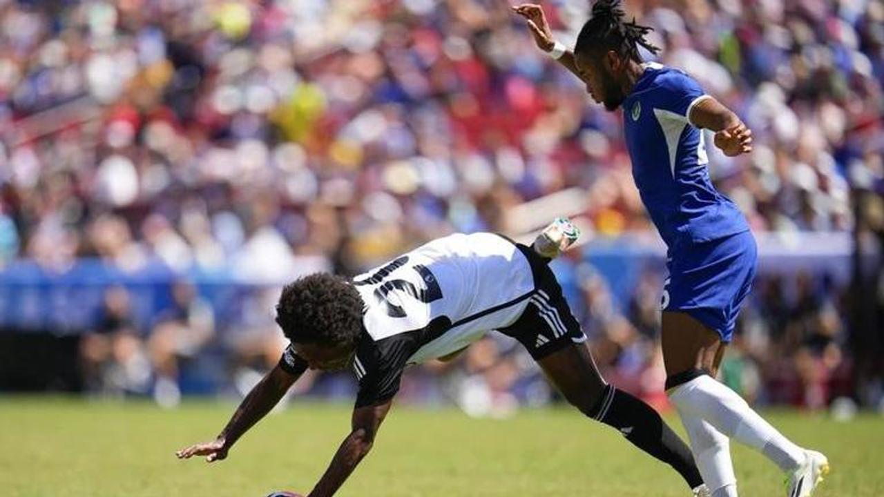 Fulham’s William, left, is fouled by Chelsea’s Christopher Nkunku during a Premier League