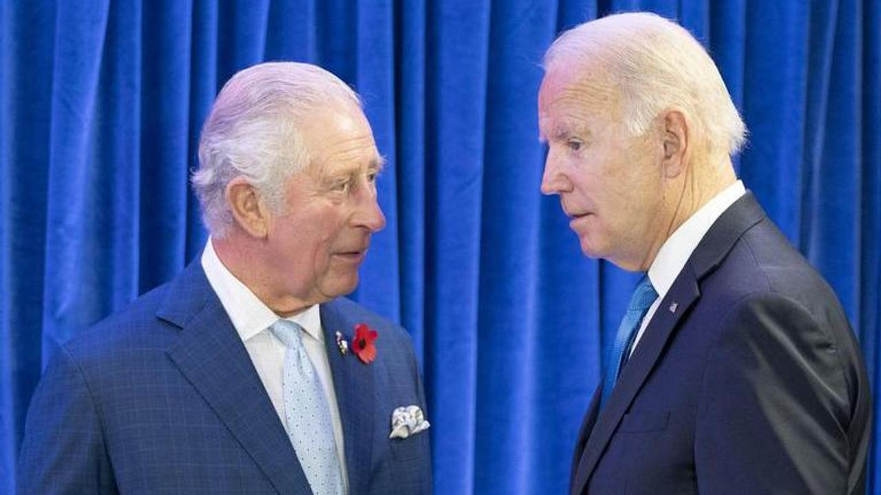 Britain's Prince Charles, left, greets the President of the United States Joe Biden