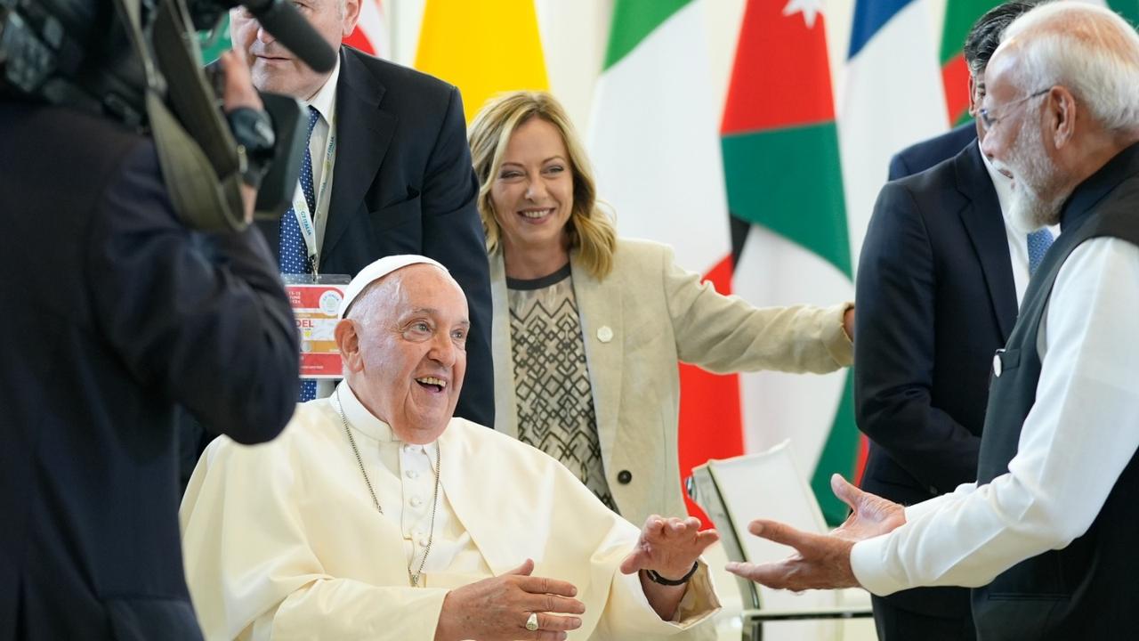 PM Modi (R) greets Pope Francis during a working session on AI, Energy, Africa and Mideast, at the G7, June 14, 2024, in Borgo Egnazia, near Bari, Italy. 