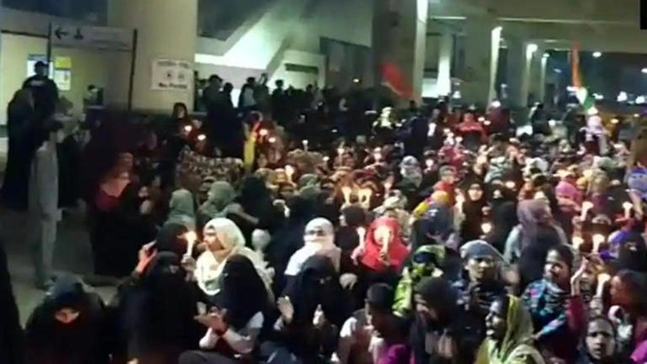 People gather near Jaffrabad metro station in Delhi to protest