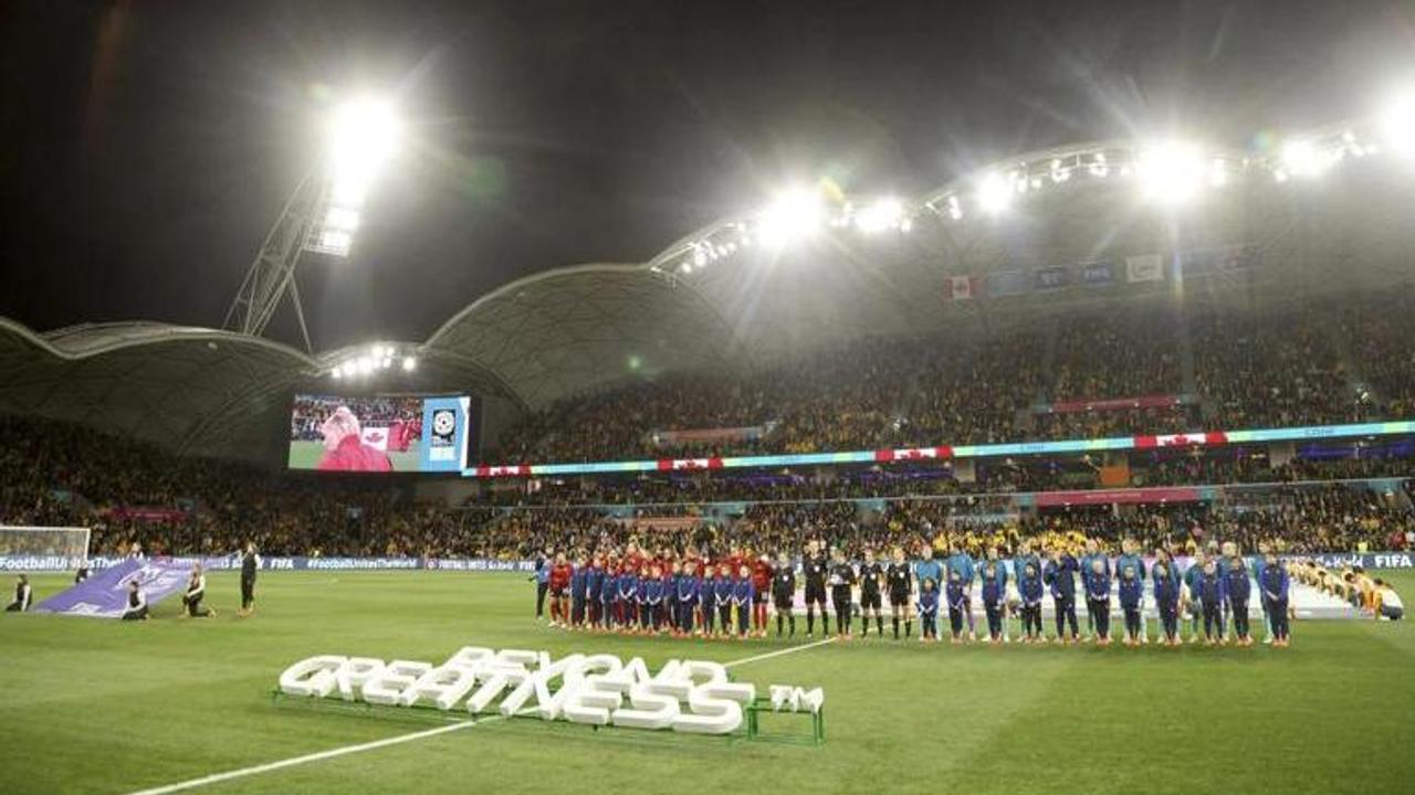 Canada and Australia players lineup for national anthems