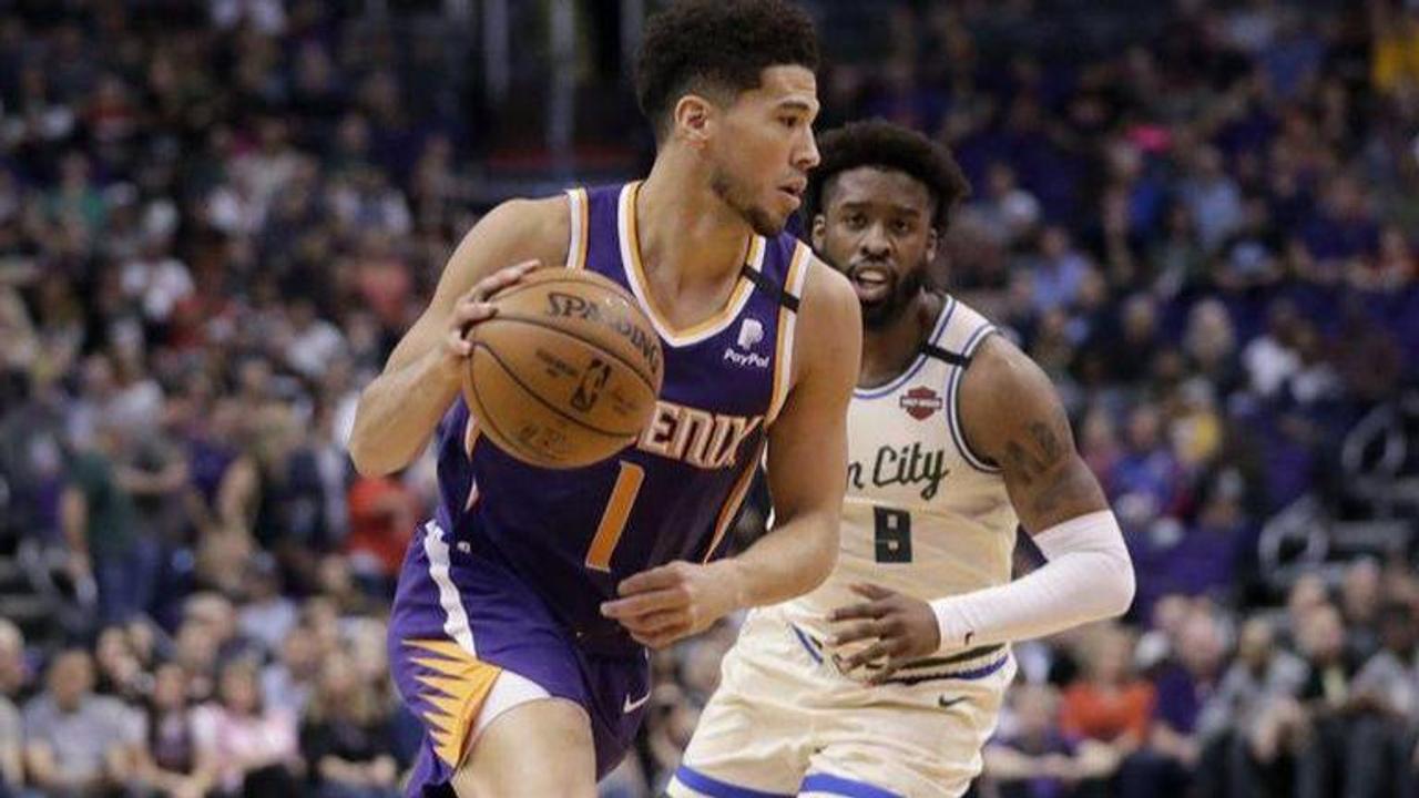 Booker, Rubio help Suns race past Giannis-less Bucks