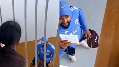 Rohit Sharma interacts with a fan