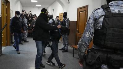 One of the suspects in Moscow terror attack escorted by police officers in the Basmanny District Court in Moscow