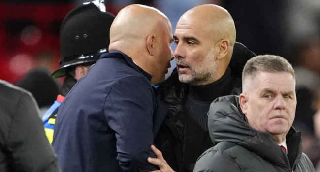 Pep Guardiola and Arne Slot