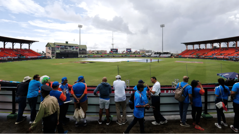 A stadium in West Indies covered with the tarp as rain passes by