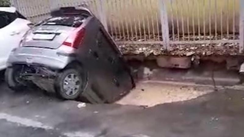 Car Submerged in Pothole, Due to Waterlogging