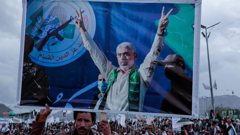 A Houthi terrorist with Yahya Sinwar's poster.