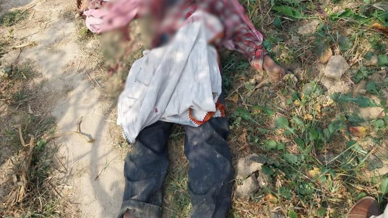 A laborer identified as Ashok Kumar, originally from Bihar and working as a corn seller, was found dead with bullet wounds and stabbing marks on his body