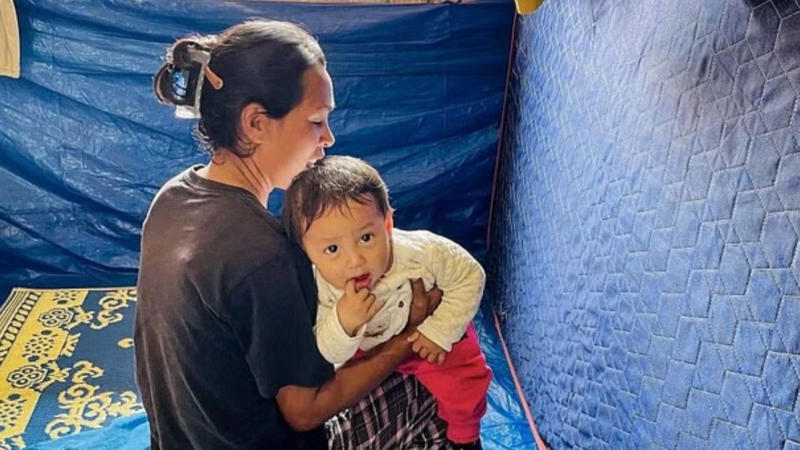 A Woman with her Baby in a shelter camp in Manipur