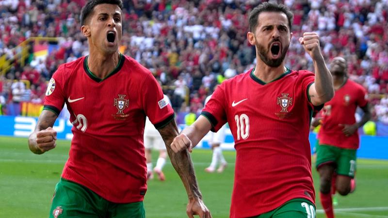 Bernardo Silva and Joao Cancelo celebrate Portugal goal vs Turkey at Euro 2024