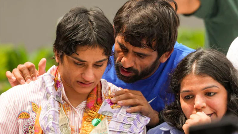 As Vinesh Phogat broke down, she was consoled by Bajrang Punia and Sakshi Malik