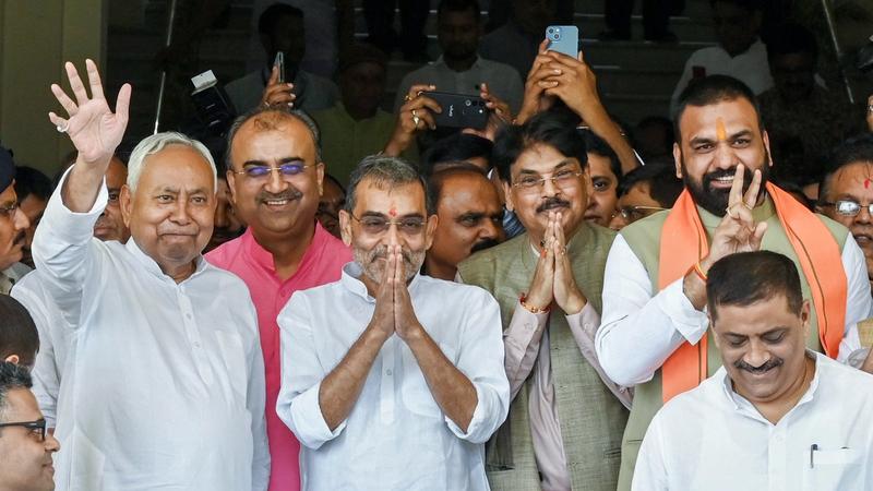 Bihar Chief Minister Nitish Kumar with NDA candidate Upendra Kushwaha and Manan Kumar Mishra after they filed nomination paper for Rajya Sabha election at Bihar Vidhan Sabha, in Patna,