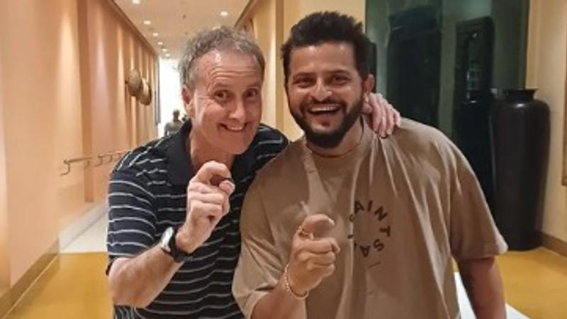 Billy Bowden and Suresh Raina