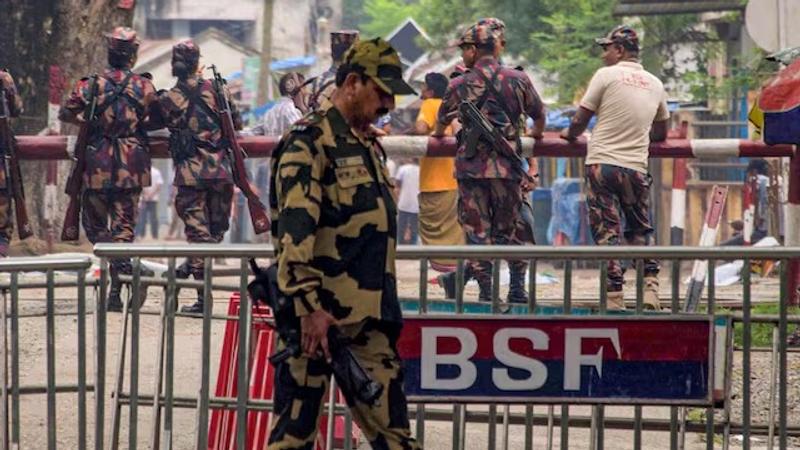  BSF personnel stands guard at the India-Bangladesh border checkpost.