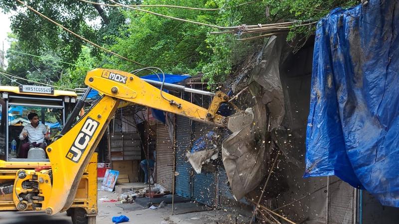 bulldozer on more than 200 illegal constructions