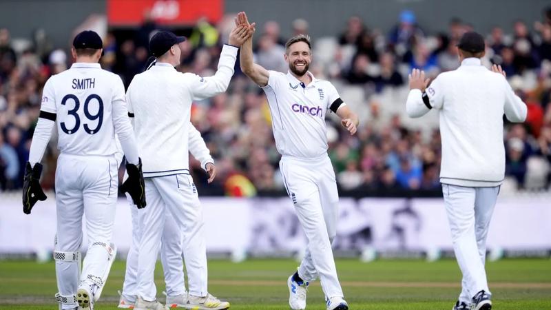 Chris Woakes celebrates a fall of wicket