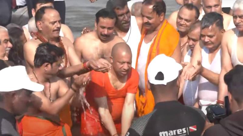 cm yogi with cabinet ministers take holy dip in triveni sangam