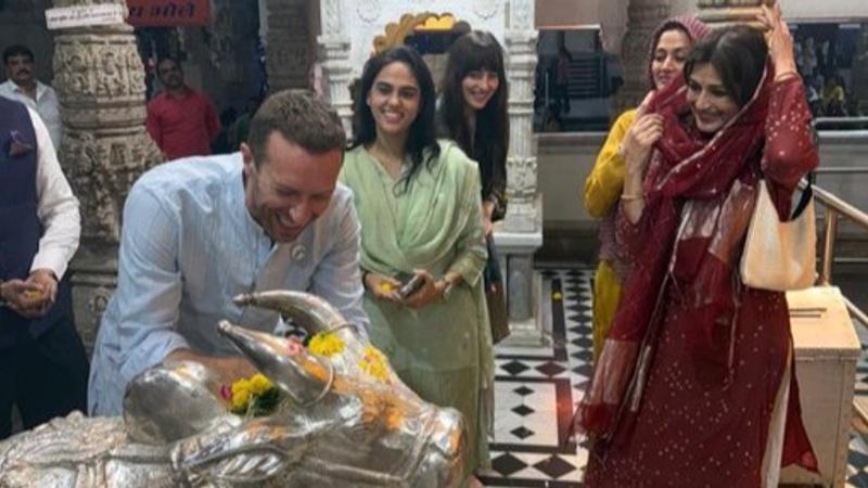 Dakota Johnson and Chris Martin at Siddhivinayak