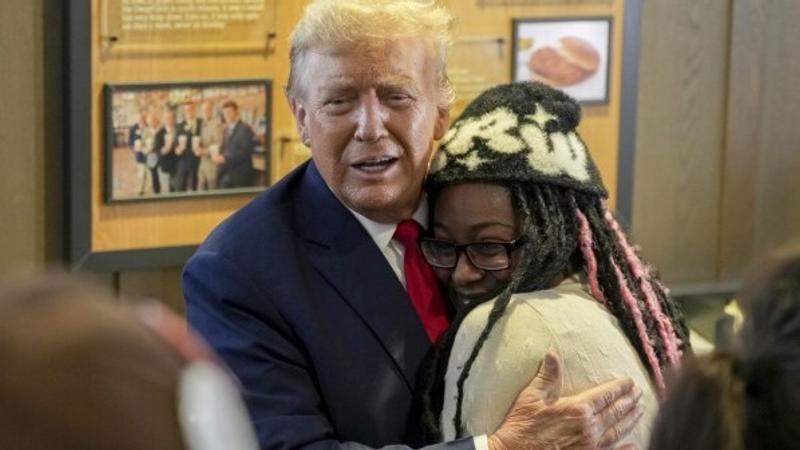 Donald Trump with a supporter during a campaign event. 