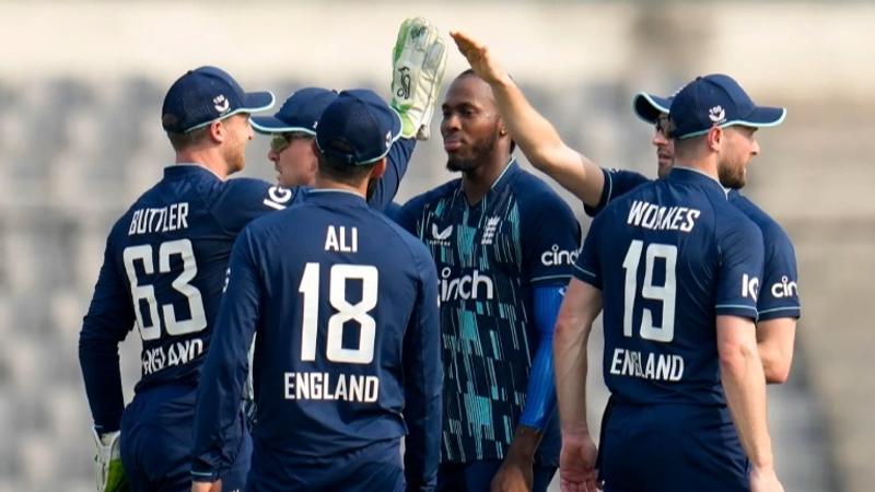 English cricket team celebrates a fall of wicket