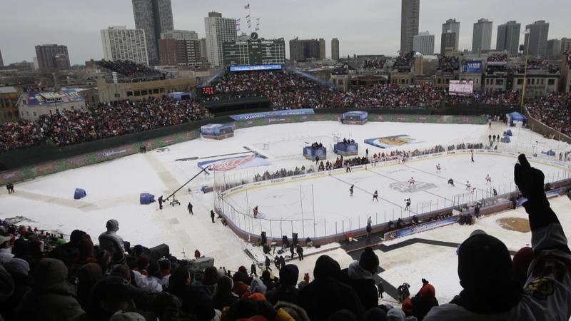 Fans cheer during the first period of the NHL Winter Classic hockey game