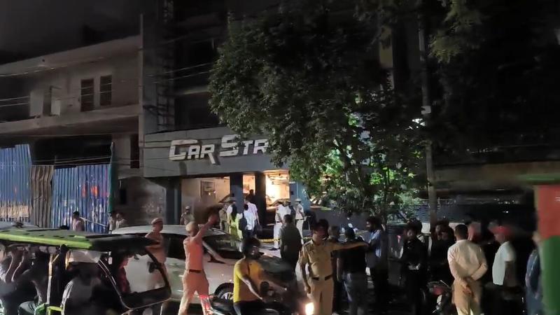 Firing at car showroom in Naraina