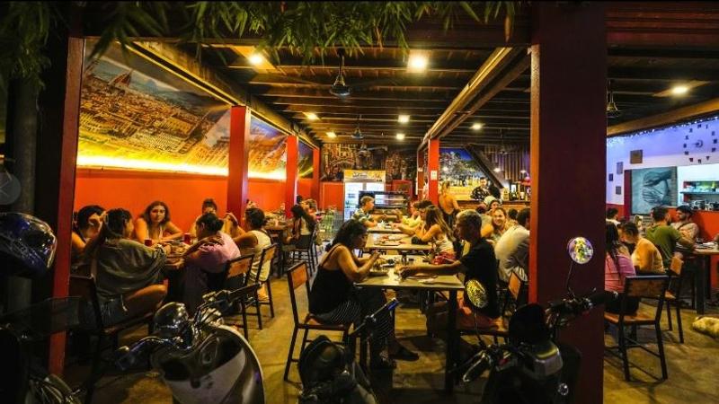 Foreign tourists at a night club at Nana Backpack hostel in Vang Vieng, Laos on November 19 