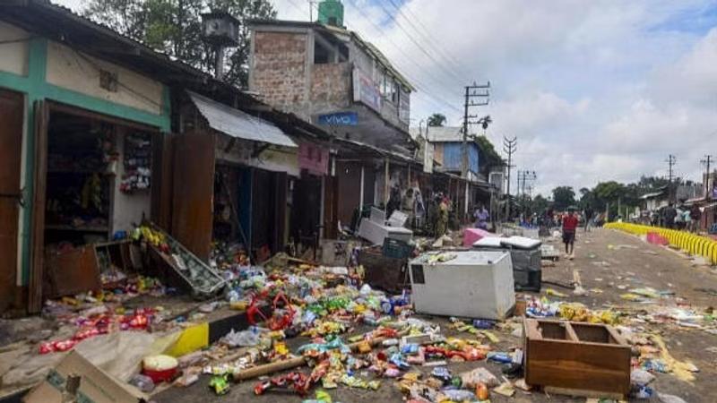 Goods thrown outside vandalised shops after clashes between two communities in Tripura