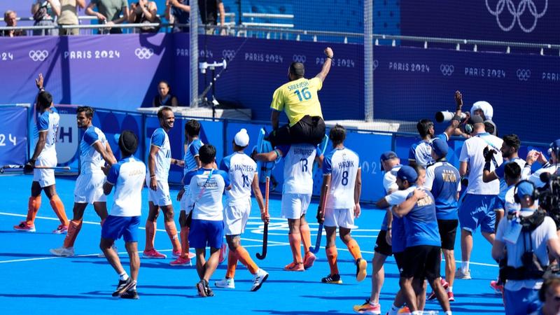 Indian men's hockey team celebrates their bronze medal triumph with fans