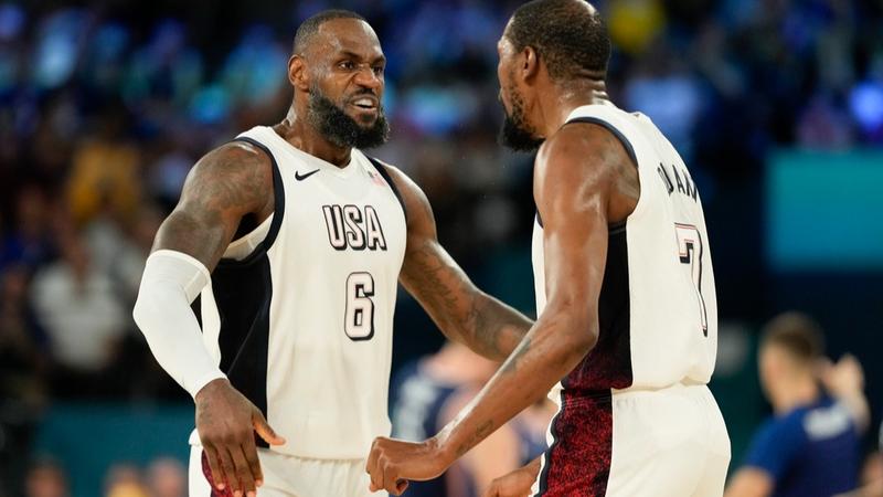 LeBron James and Kevin Durant celebrate as Team USA enters Paris Olympics final