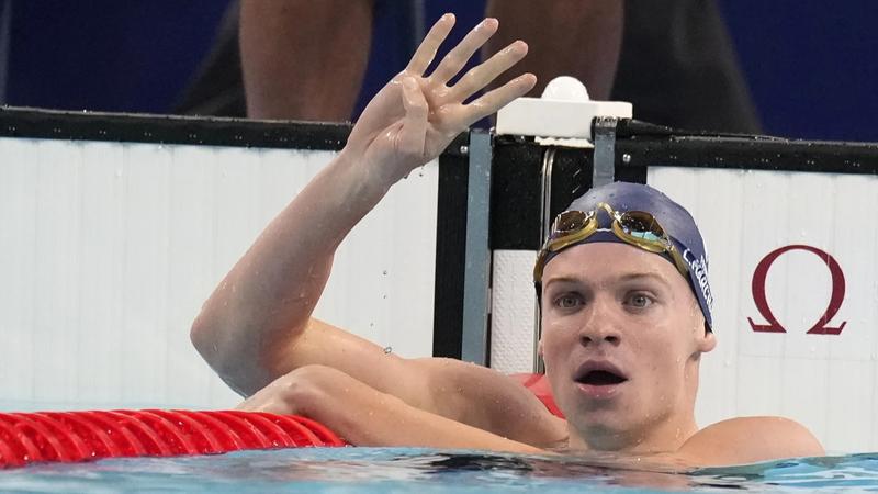 Léon Marchand captures 4th Olympic swimming gold, setting off a party across Paris