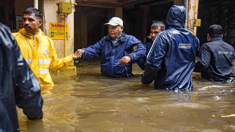 Locals being evacuated due to heavy waterlogging following incessant rains, in Pune district