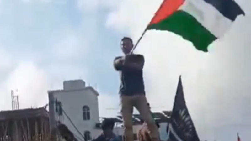 Man waves Palestinian Flag in Dumka