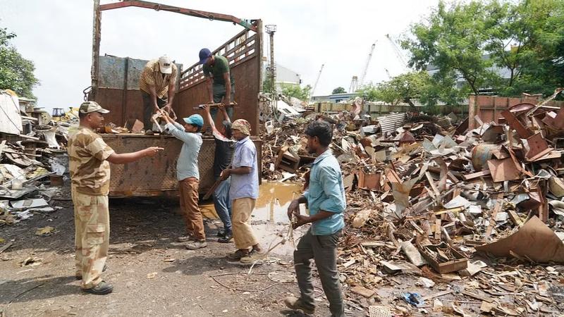 Metal scrap being removed and disposed off