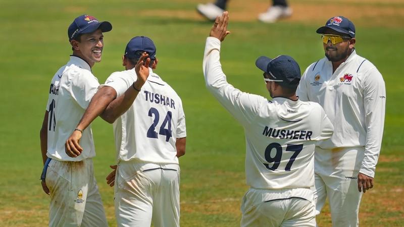 Mumbai Team celebrates a fall of wicket