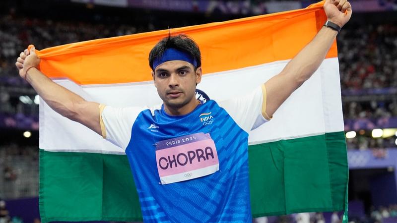 Neeraj Chopra celebrates his silver medal at Paris Olympics