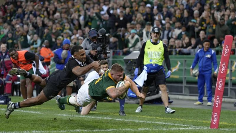 New Zealand’s Sevu Reece left, is to late to prevent South Africa’s Malcom Marx from scoring a try 