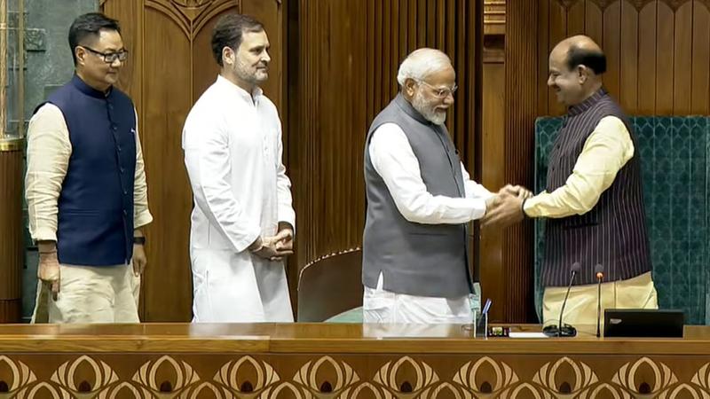 Prime Minister Narendra Modi greets Om Birla after the latter was elected as the Speaker of the House during the first session of the 18th Lok Sabha