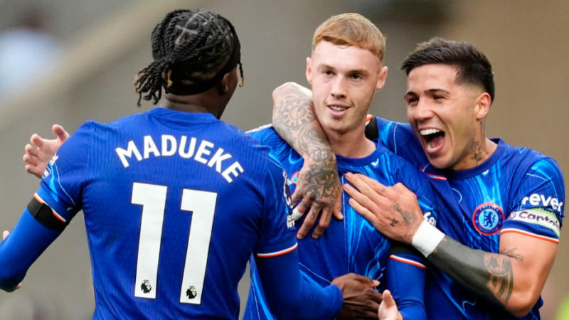 Noni Madueke, Cole Palmer and Enzo Fernandes celebrate Chelsea's goal in 6-2 win over Wolves.