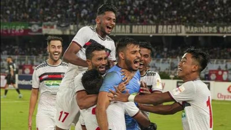 NorthEast United players celebrate.