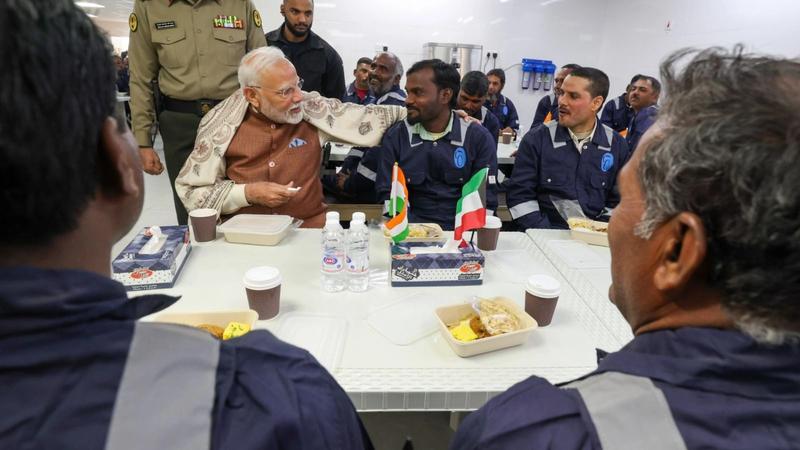 PM Narendra Modi visited the Gulf Spic Labour Camp in Kuwait, where he interacted with Indian workers and highlighted their contribution to development.