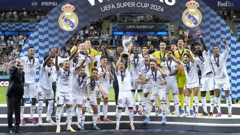 Real Madrid’s Luka Modric lifts the trophy after winning the UEFA Super Cup Final